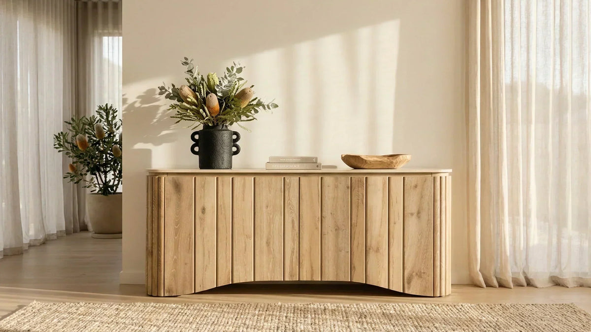 Minimalist oak sideboard styled with native botanicals in a warm neutral living room