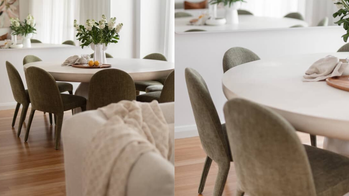 Elegant dining setup by Studio Frost with Wyatt Dining Chairs in Leaf Green upholstery and a white round pedestal table styled with florals.