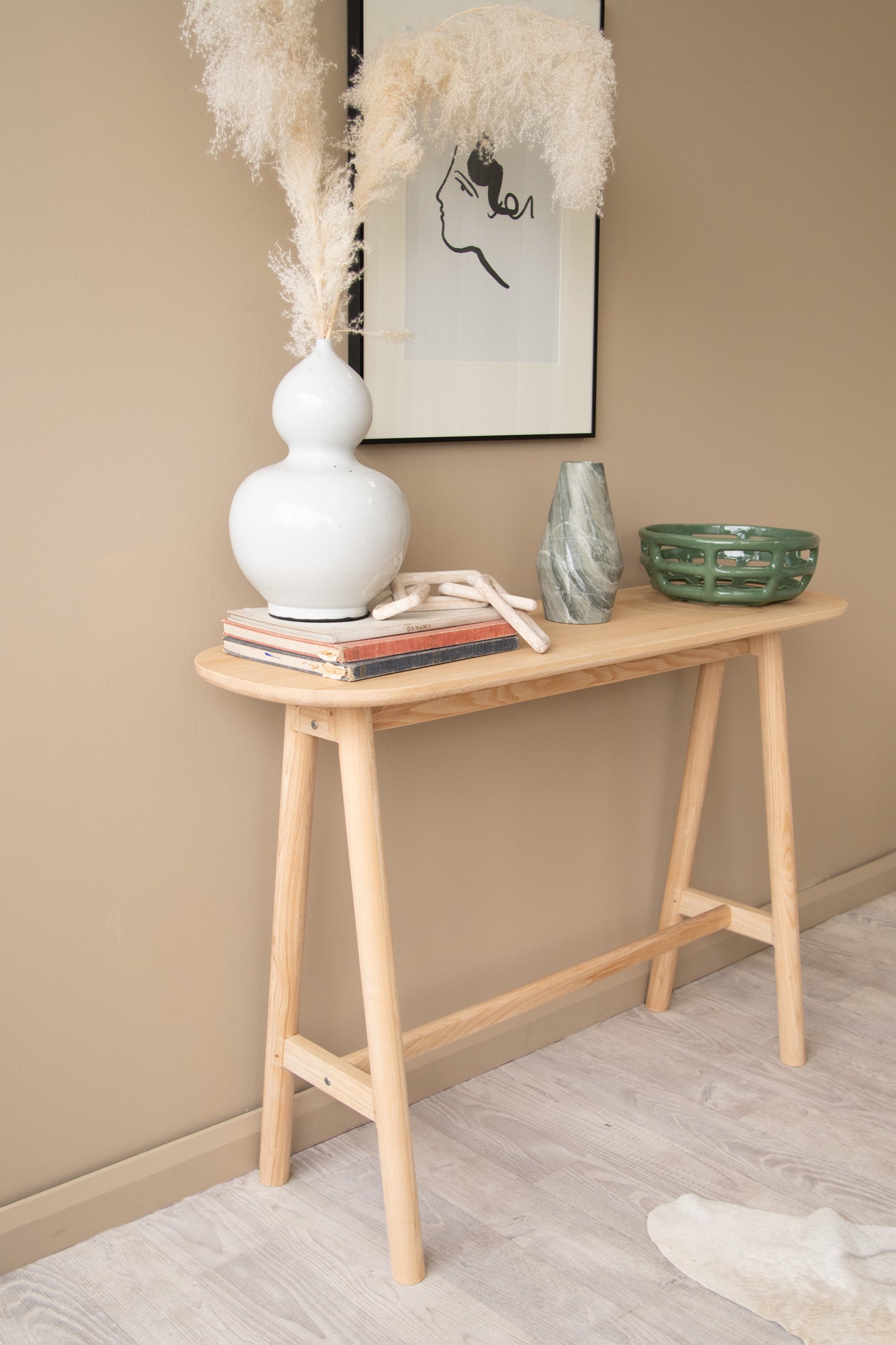 Wooden console table with decor.