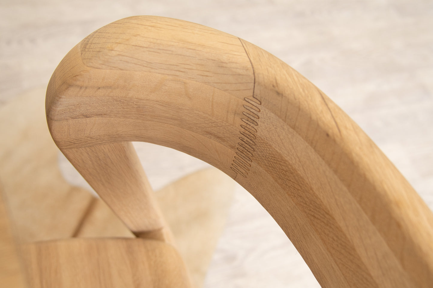 Wooden chair arm detail.