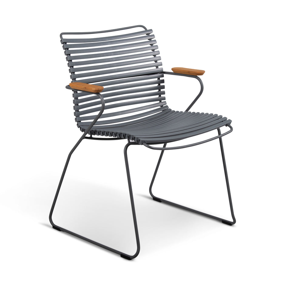 Gray metal chair with wooden armrests.
