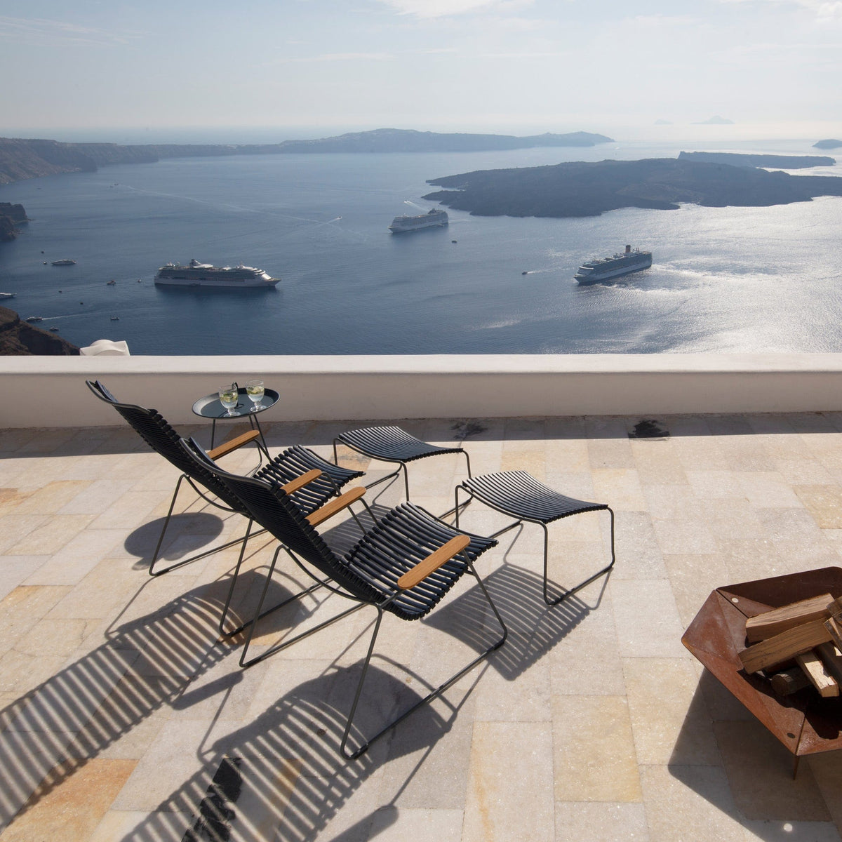 Santorini view with lounge chairs and cruise ships