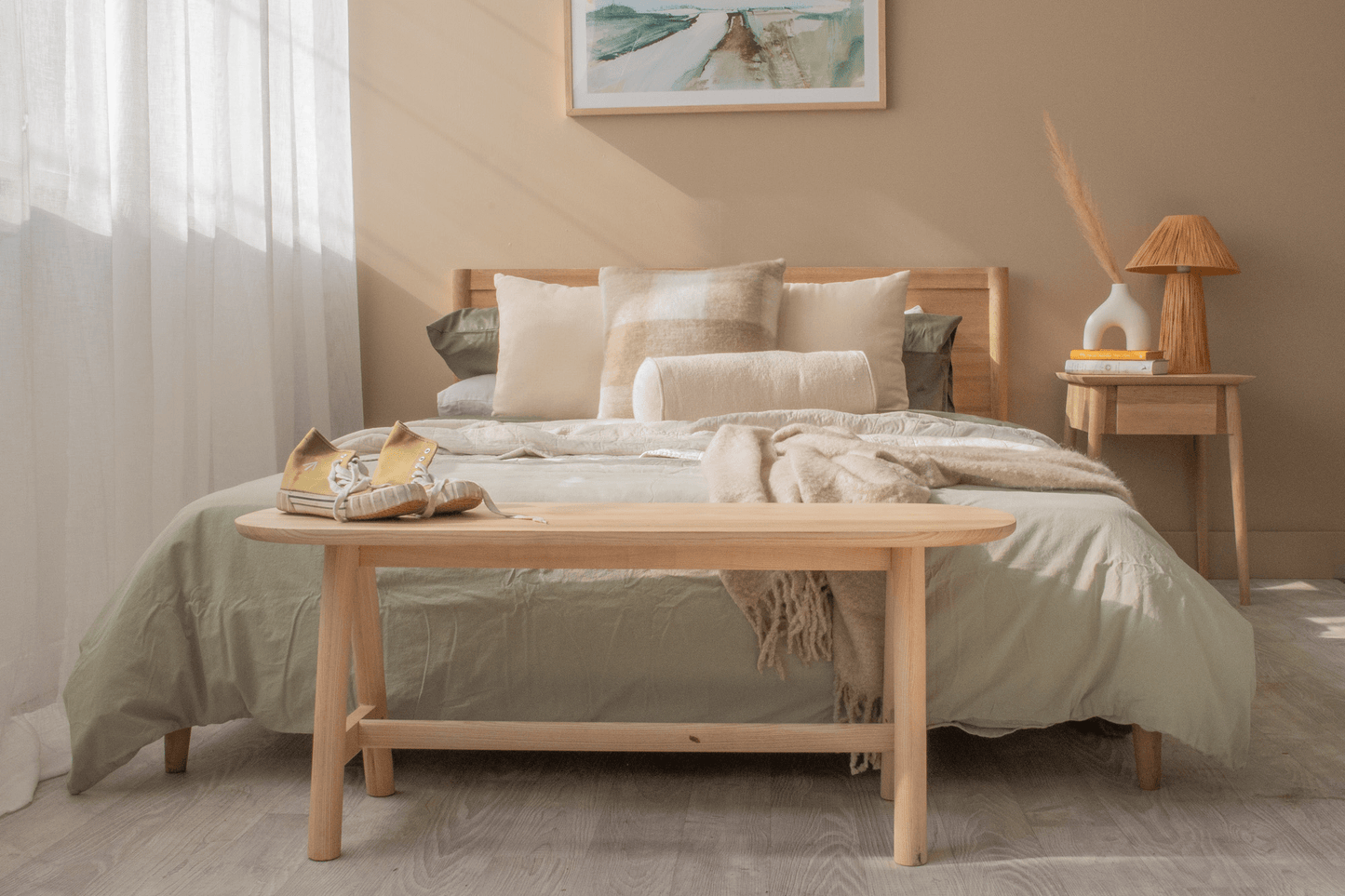 Bedroom decor with light wood furniture.