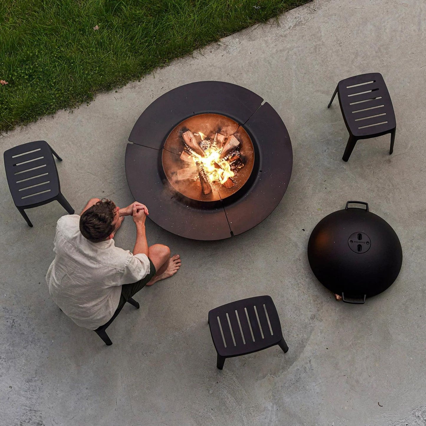 11400AS_3 outdoor fire pit with person and seating