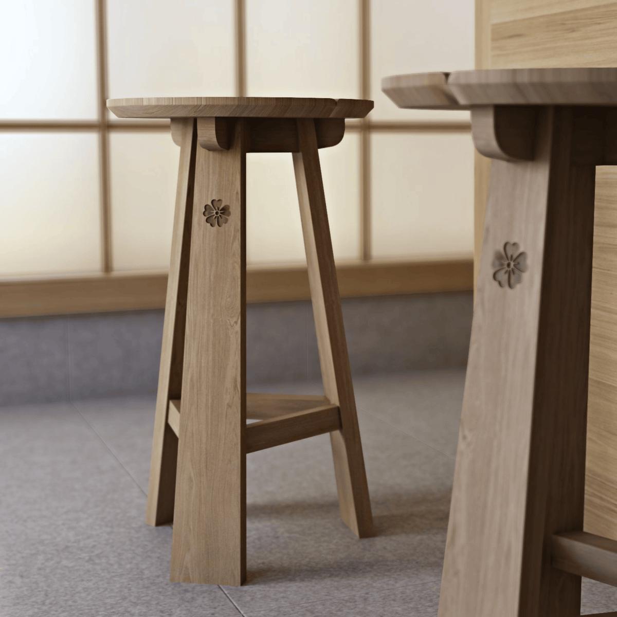 Two wooden stools with carved floral details.