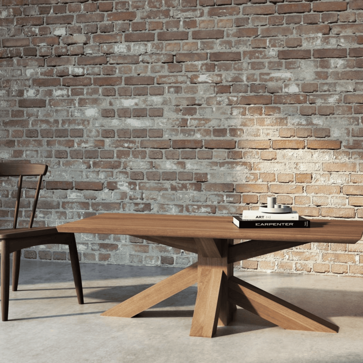 Wooden table with chair in front of brick wall.