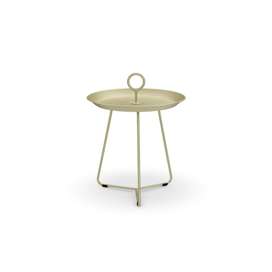 Round, light green side table with handle.