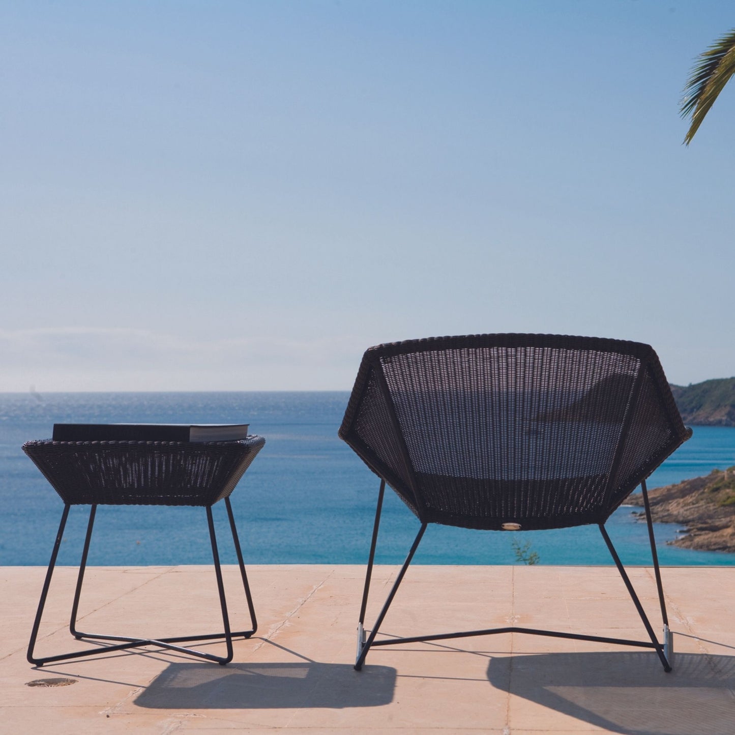5064LS_3 outdoor chair and side table overlooking the ocean.