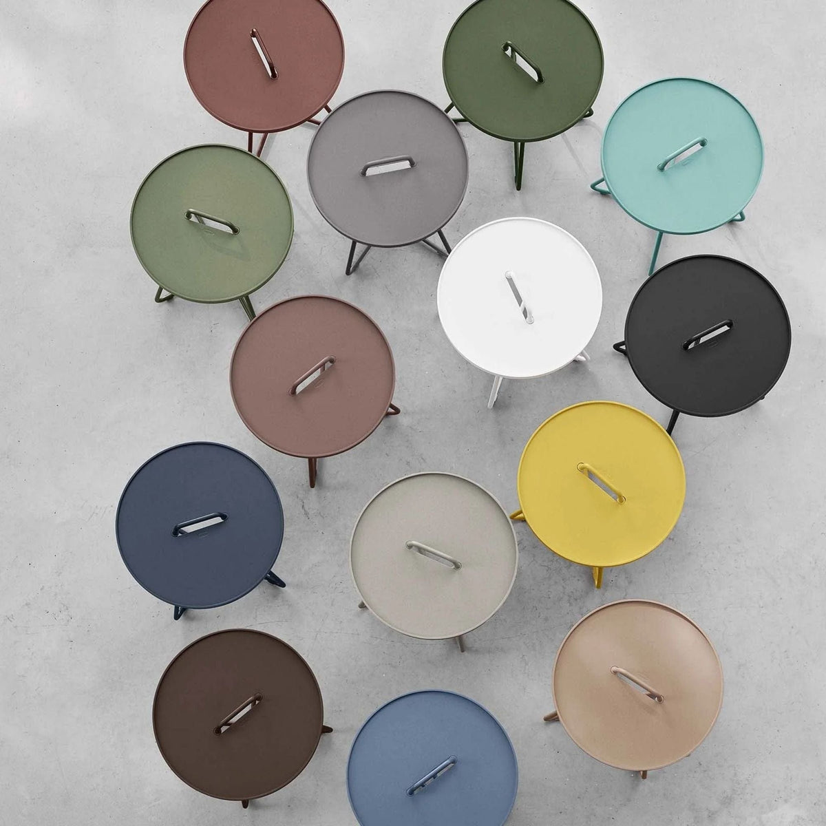 Colorful round side tables with handles