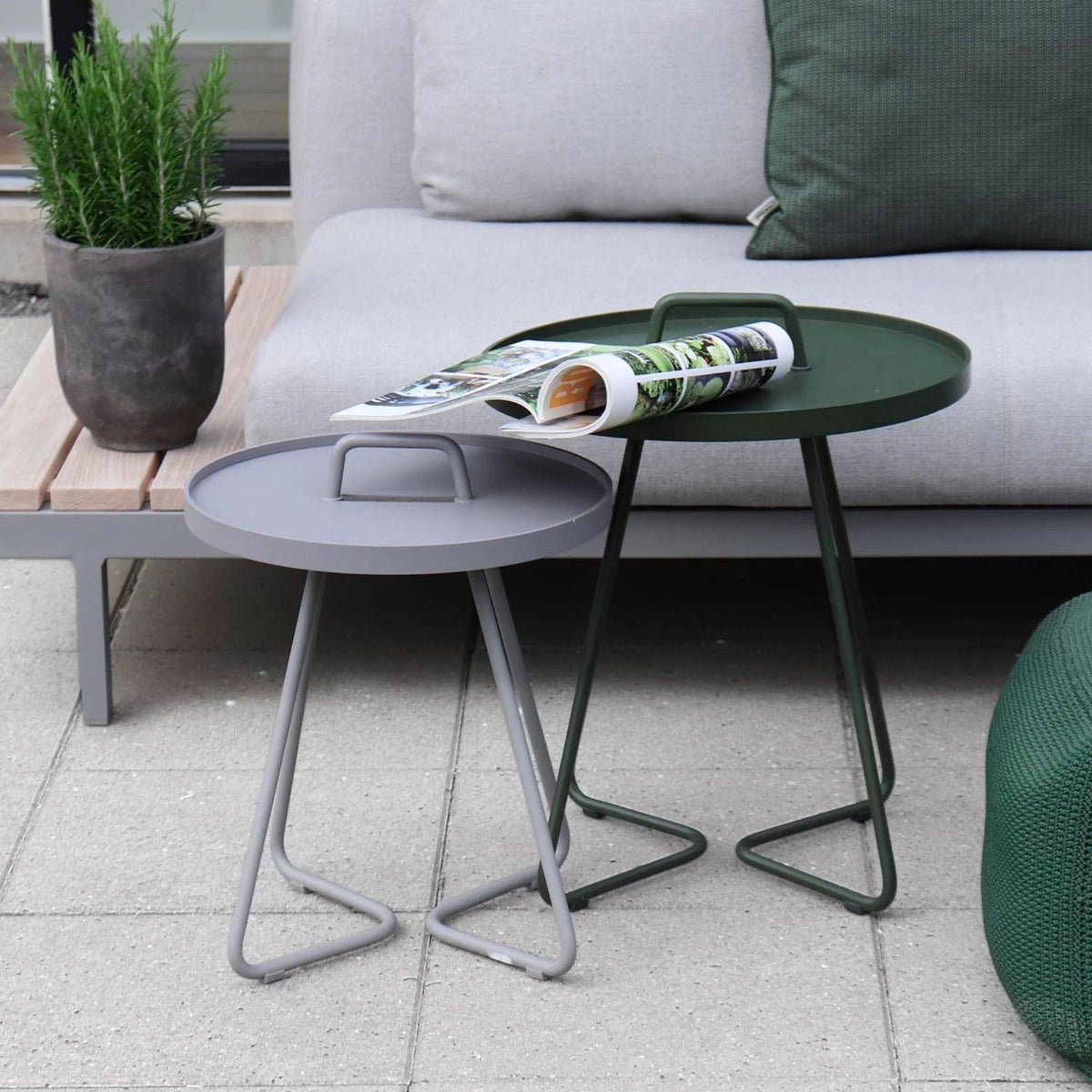 Outdoor side tables with handle, gray and green.