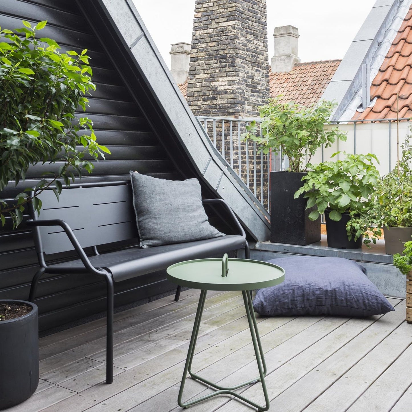 Rooftop patio with black bench and green table, 5065ADUG_2