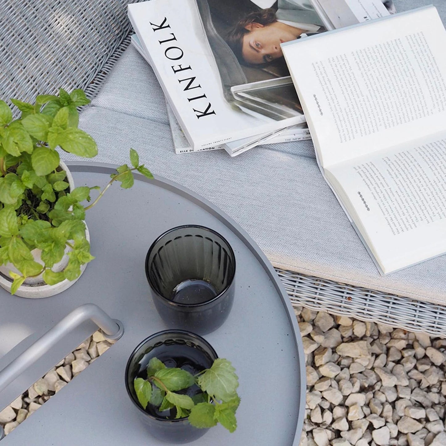 Relaxing outdoor scene with Kinfolk magazine and drinks. 5066AI_6