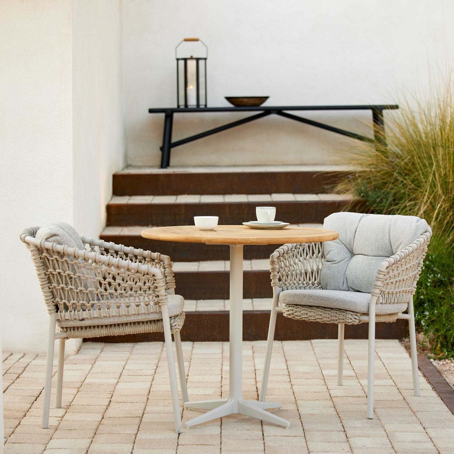 5417ROSA_02 outdoor dining set with woven chairs and round table.
