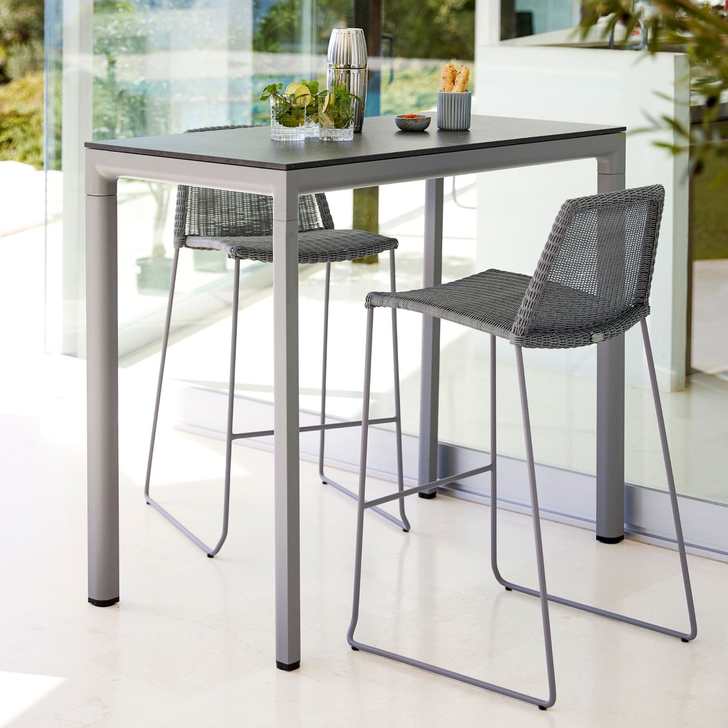 Gray outdoor bar table and stools