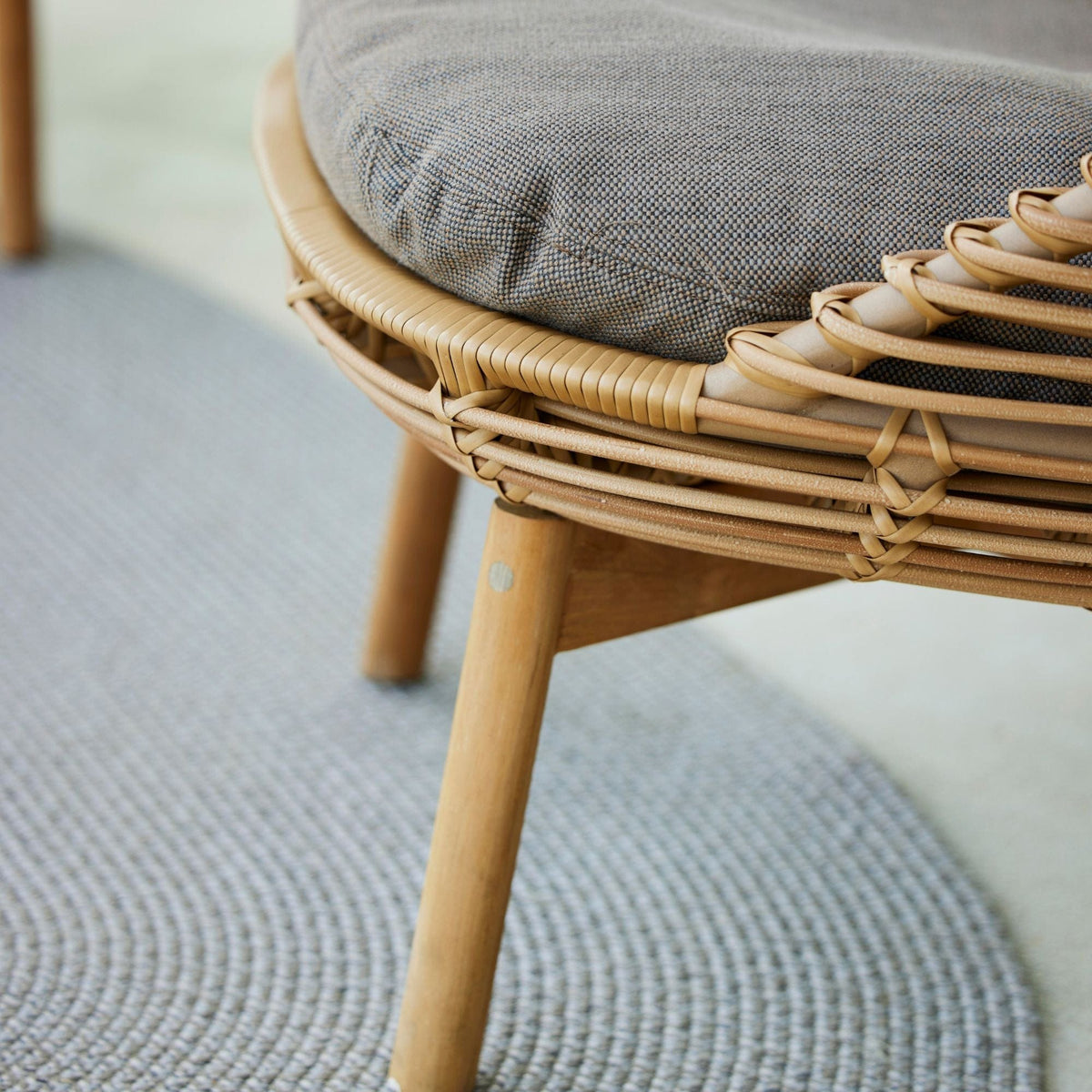 54701UT Chair detail with gray cushion and wicker frame