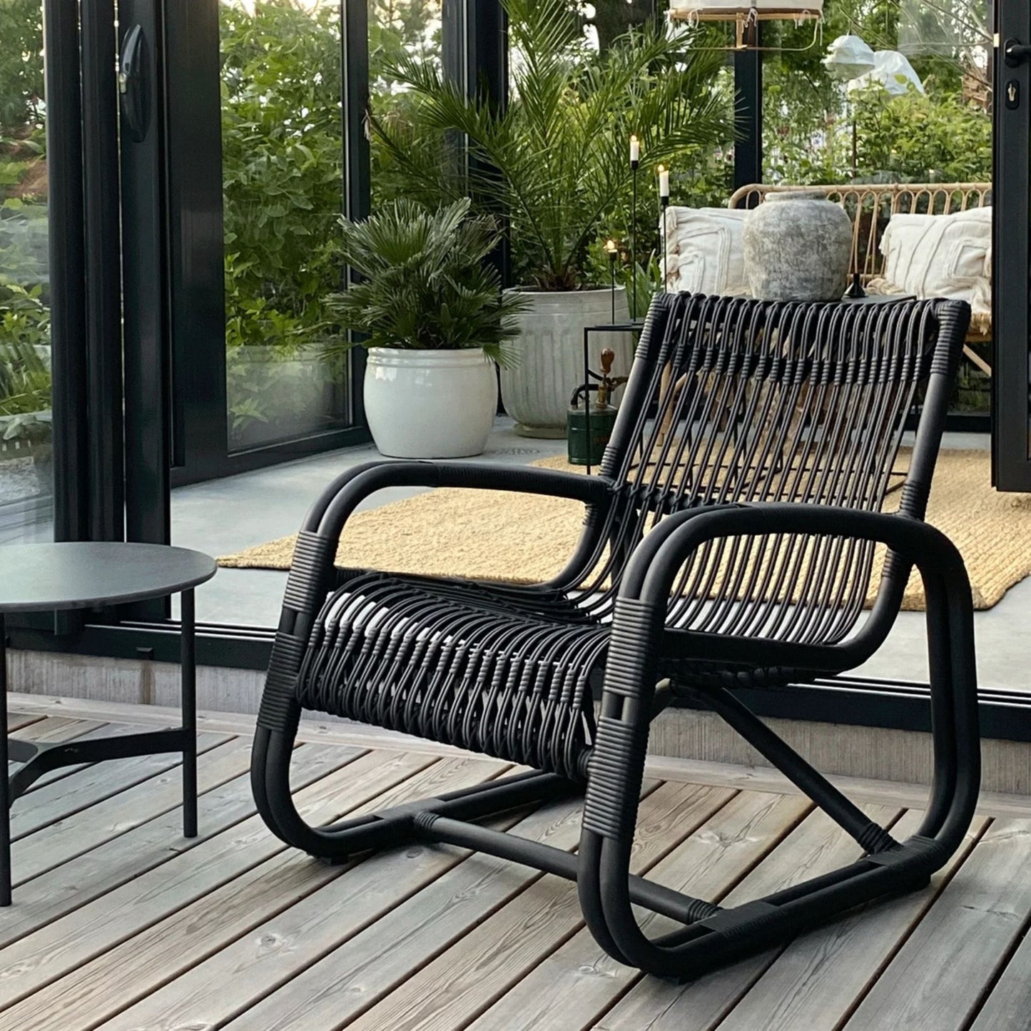 57402ALG_3 Black wicker chair on deck