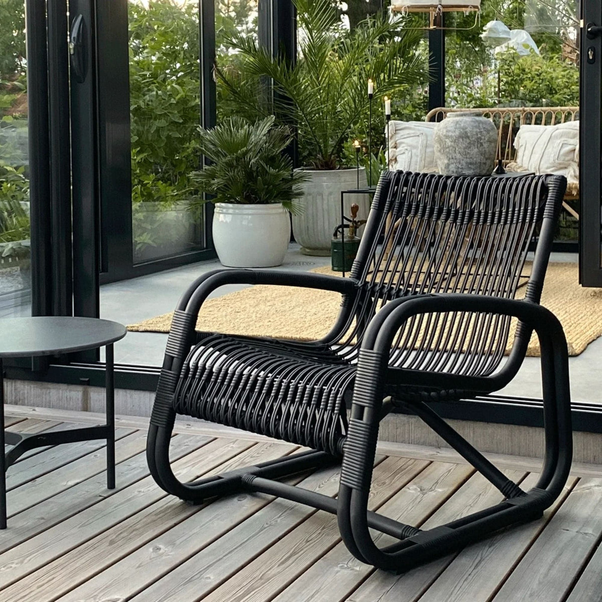 57402ALG_3 Black wicker chair on deck