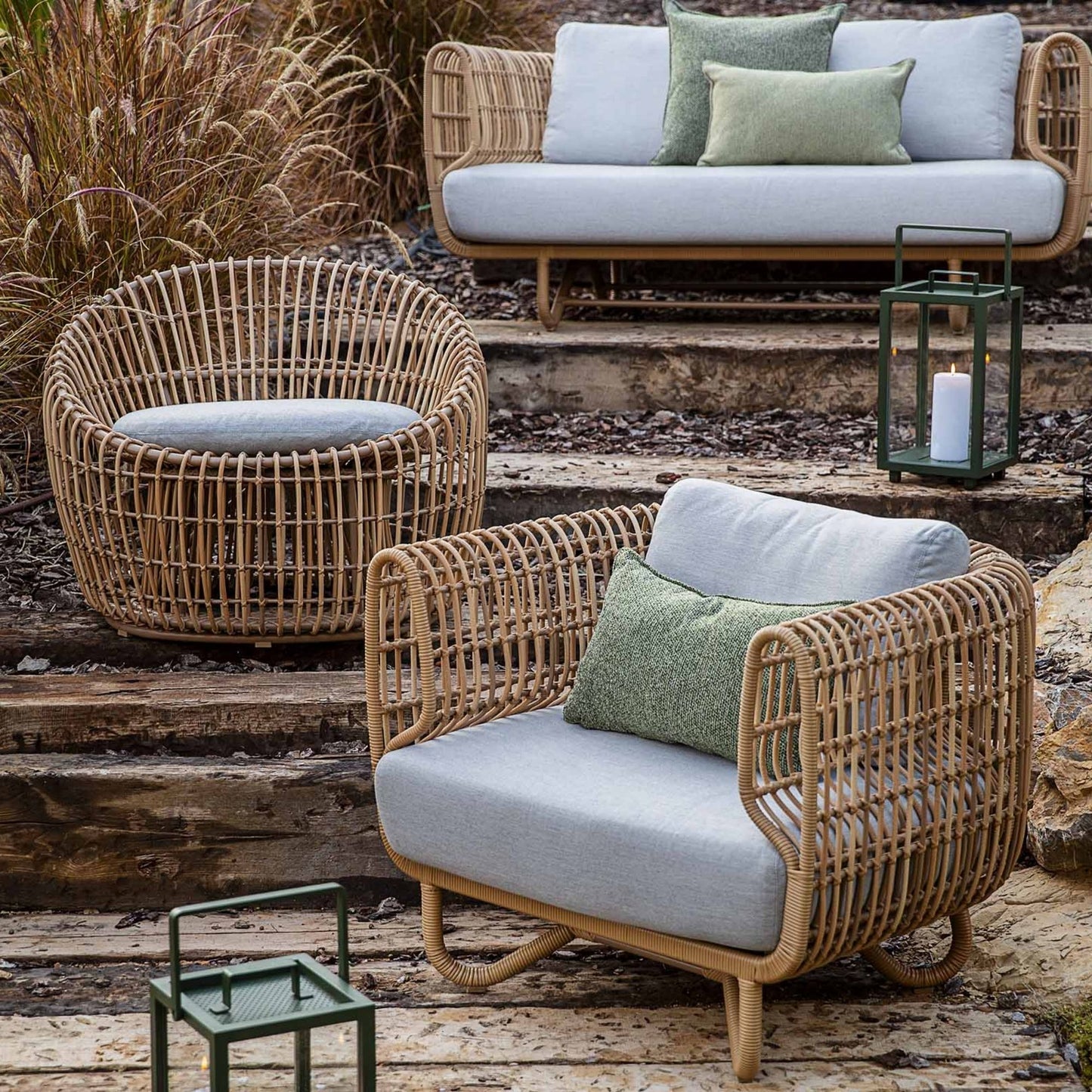 Rattan outdoor furniture set with grey cushions