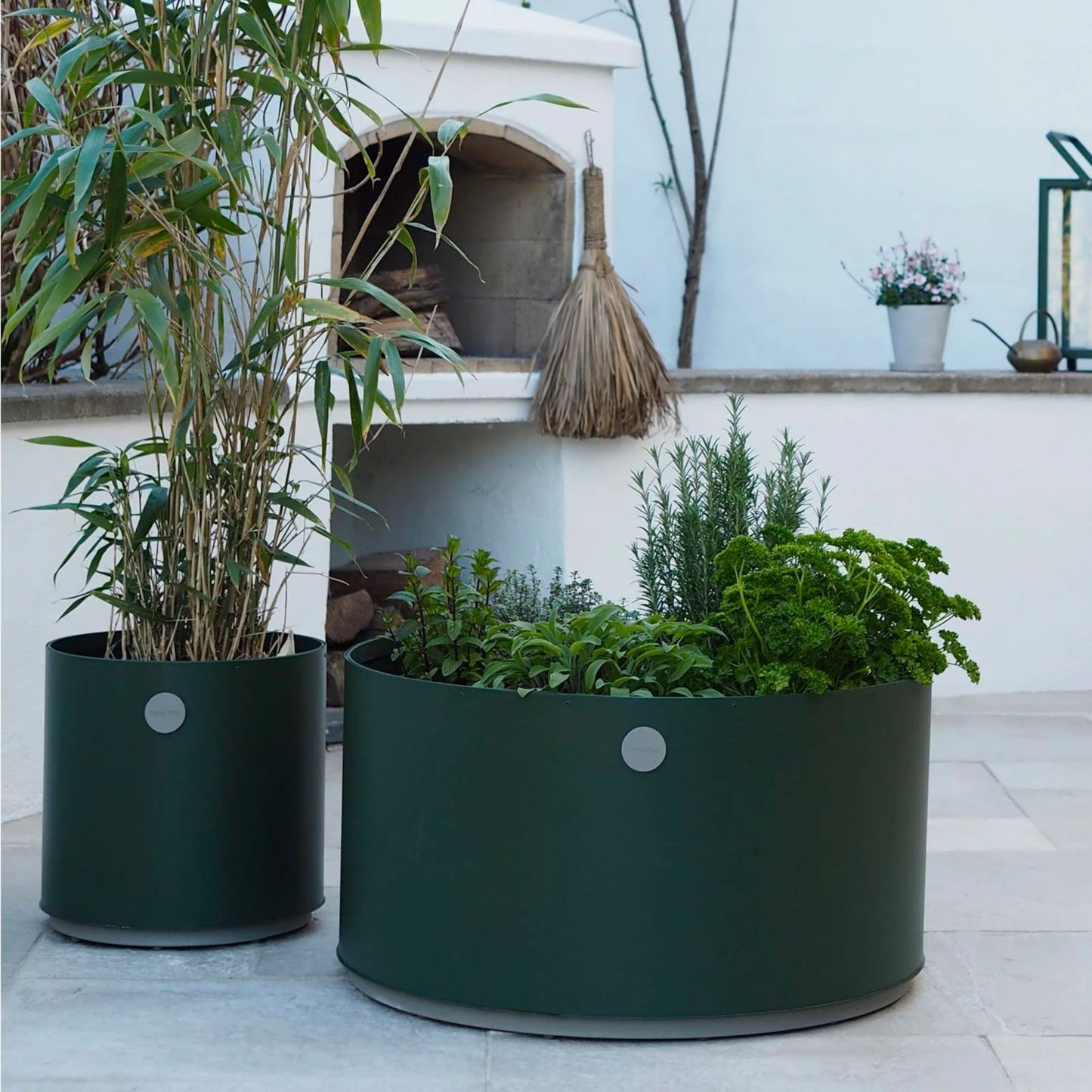 Green planters with plants on patio