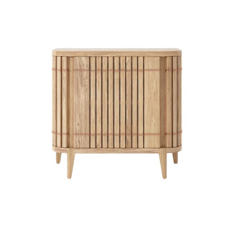 Wooden cabinet with vertical slat design.