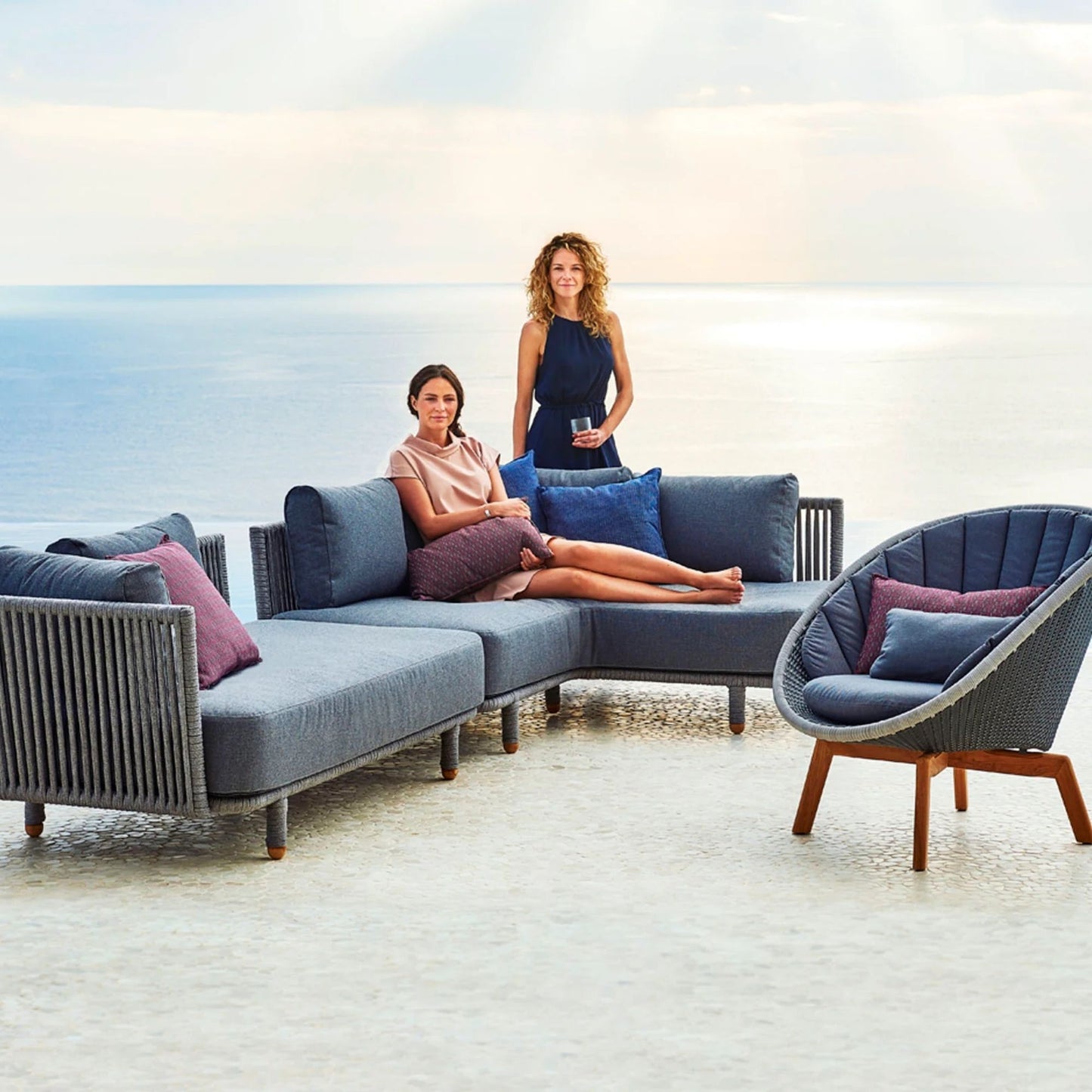 7545ROGAITG_5 outdoor seating with two women overlooking the ocean