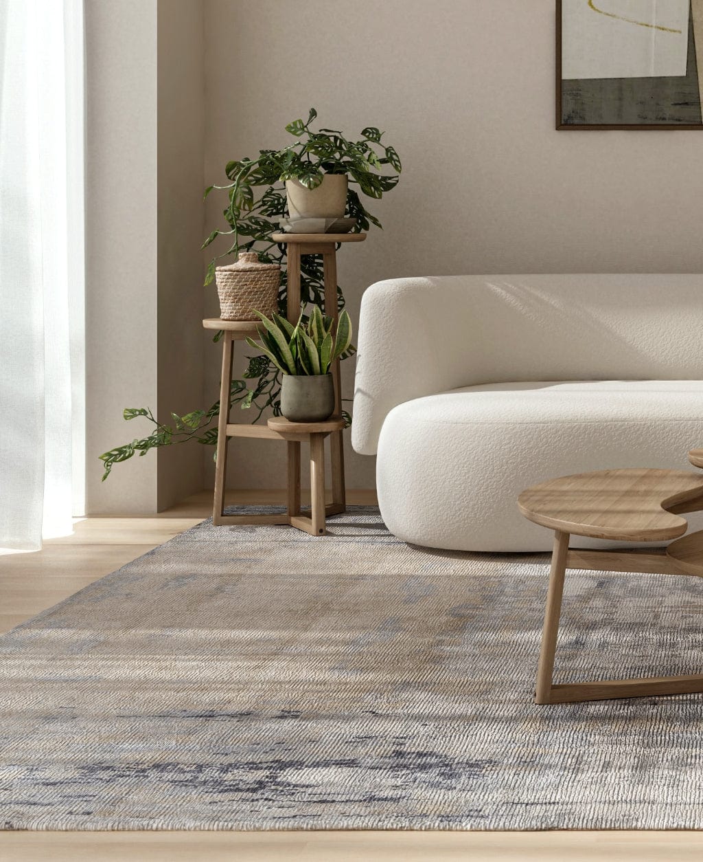 Living room with plants, sofa, and rug.