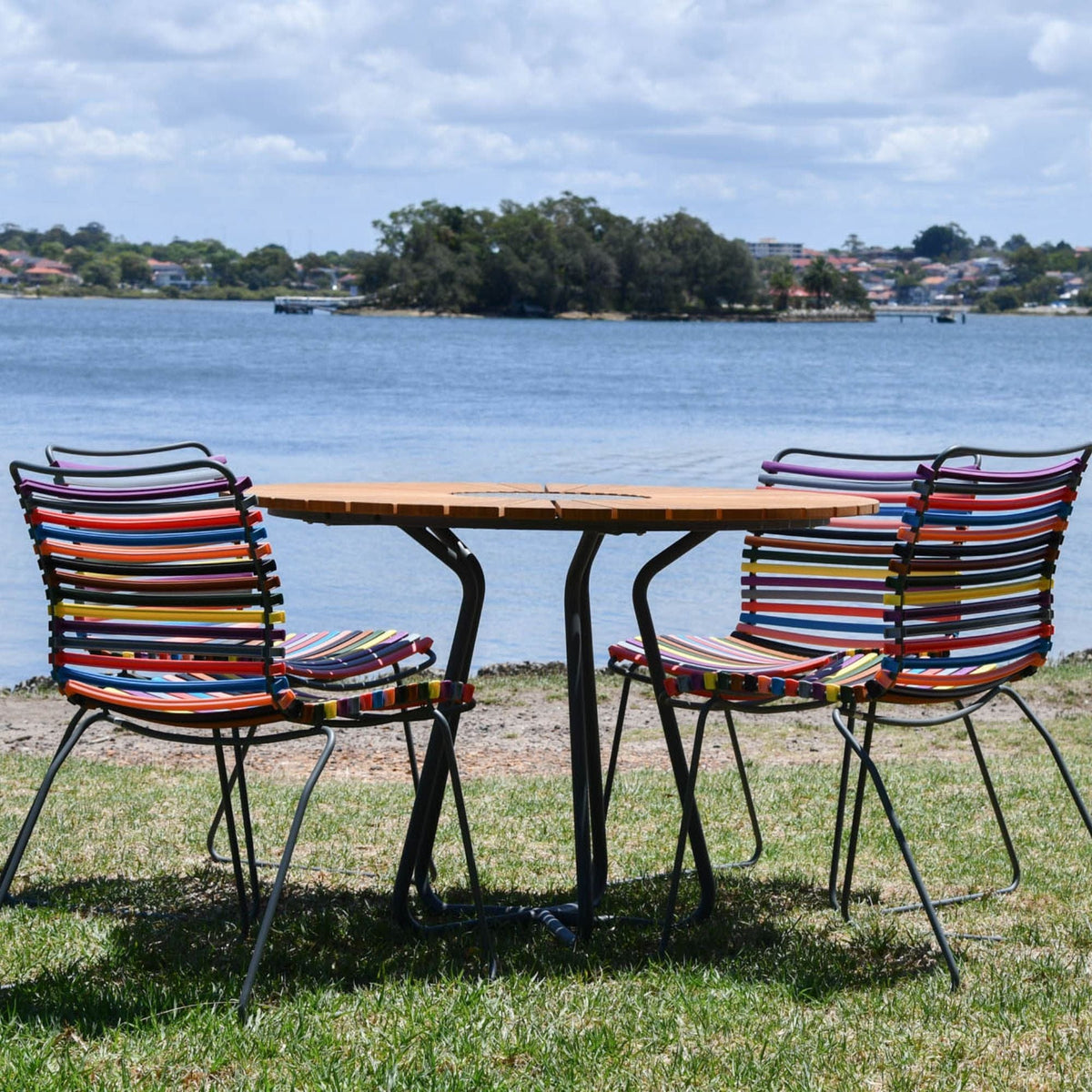 Outdoor circle table set with colorful chairs