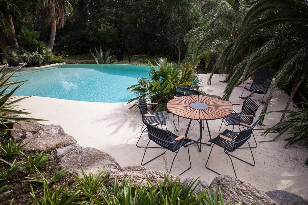 Outdoor dining set by pool