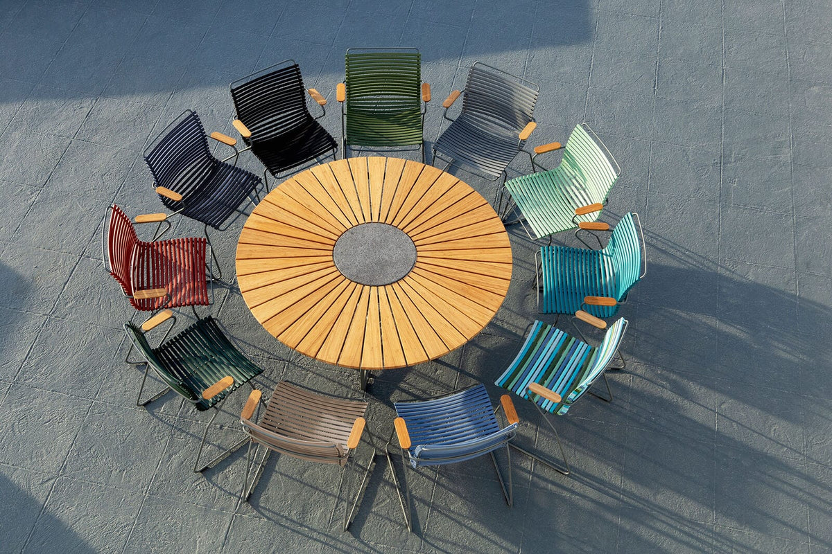 Dining table with colorful chairs in a circle