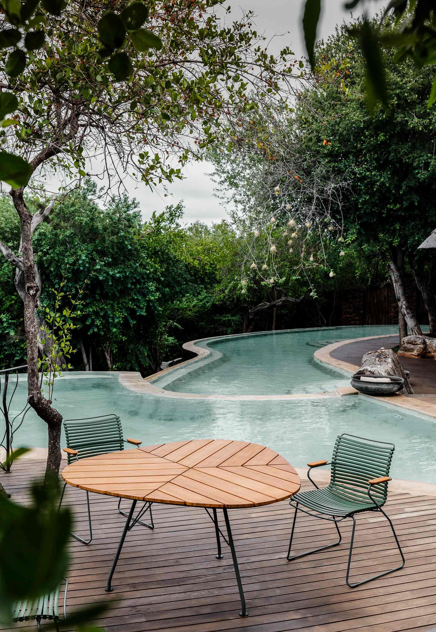 Olive green dining set by pool