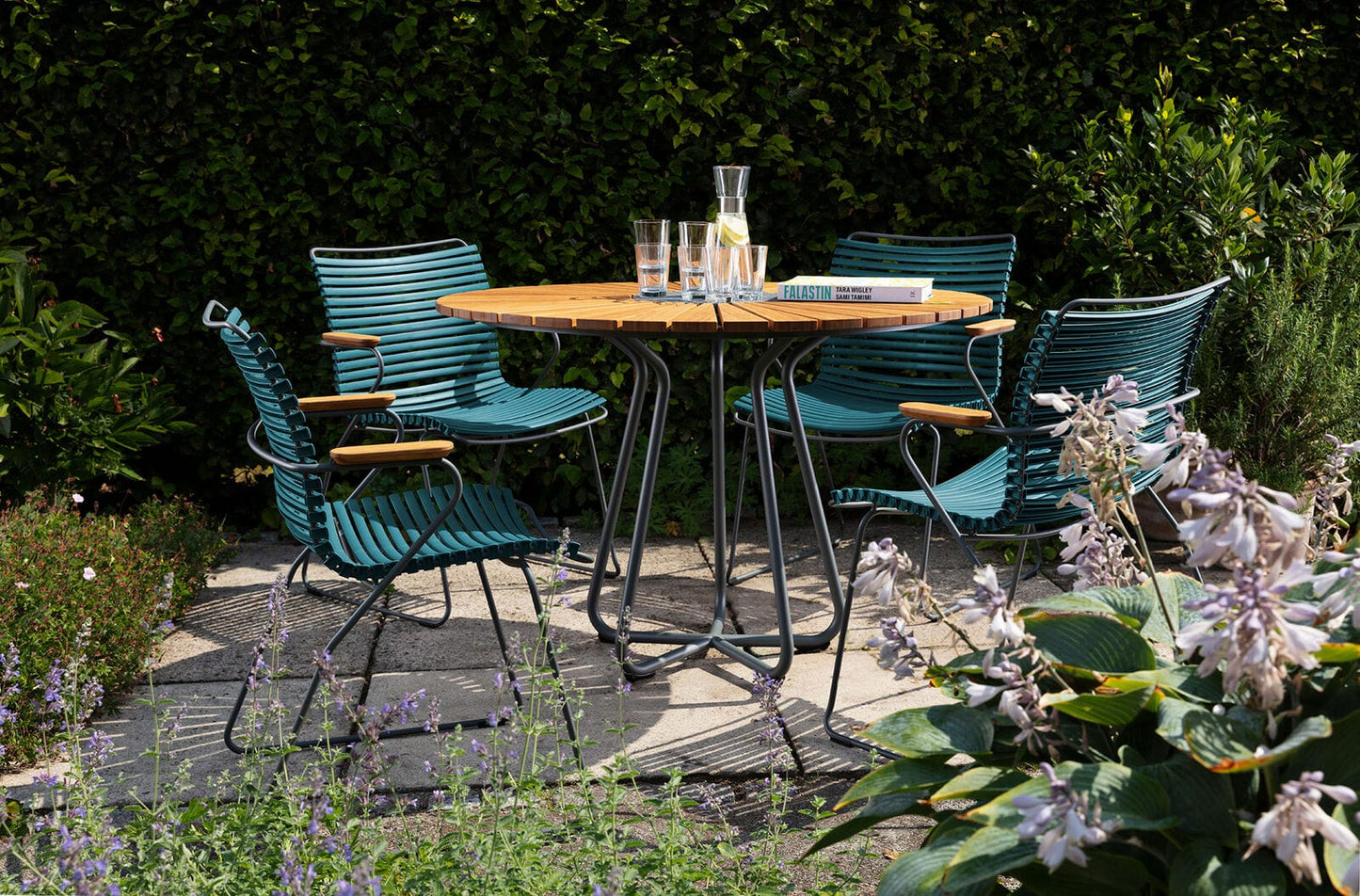 Outdoor dining set with teal chairs and table