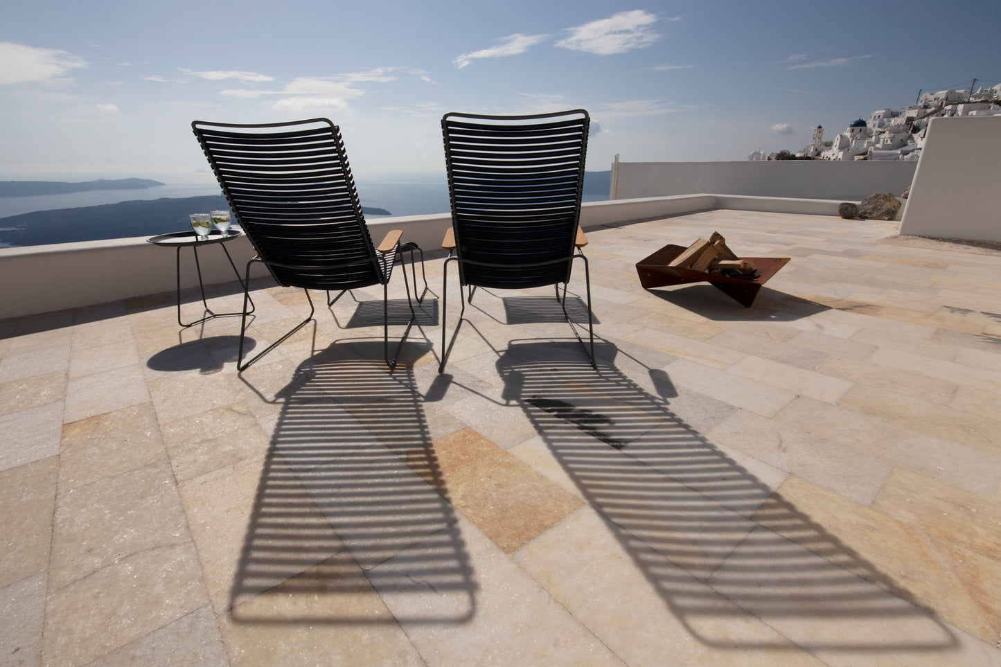 CLICK Lounge black chairs on HOUE 1976 terrace