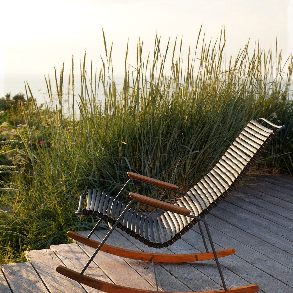 Black HOUE 1971 rocking chair on wooden deck