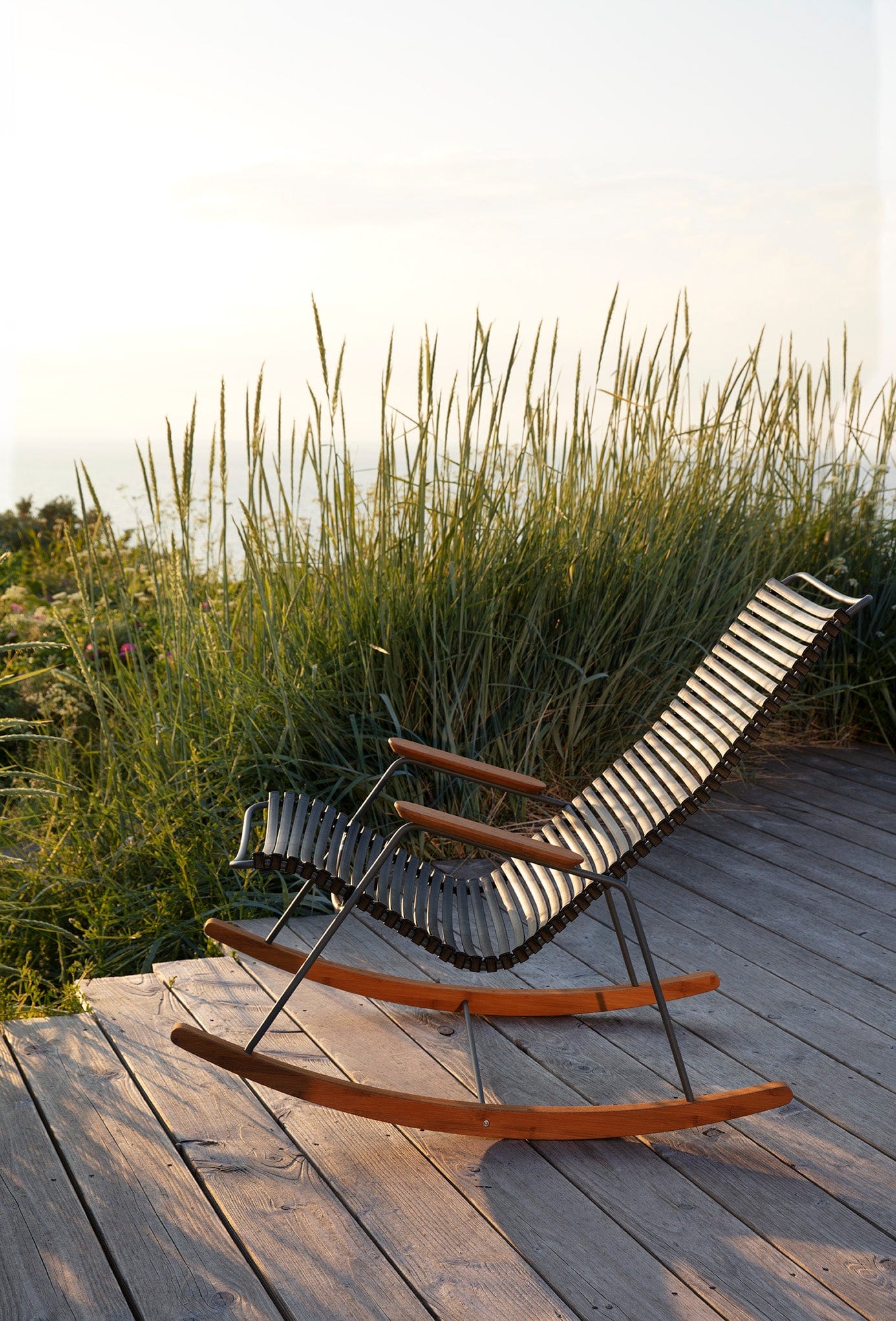 Black HOUE 1971 rocking chair on wooden deck
