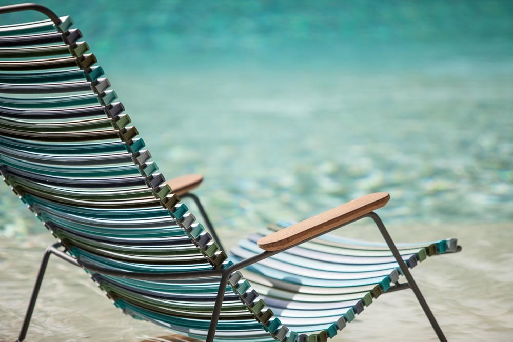 Rocking multi-striped HOUE chair by pool