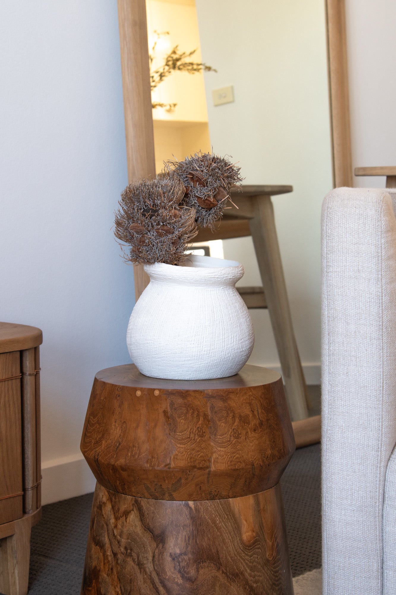 White vase with dried flowers on a wooden stool - DSC_1955