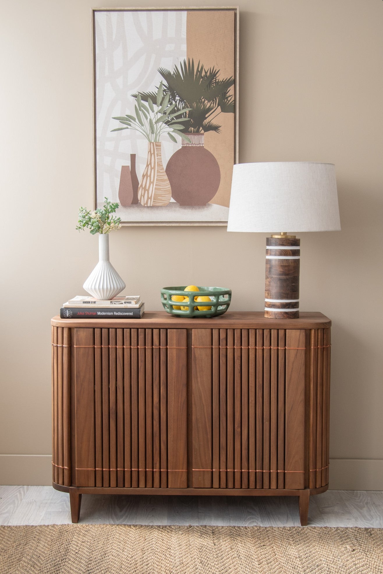 Mid-century modern sideboard with decor and lamp
