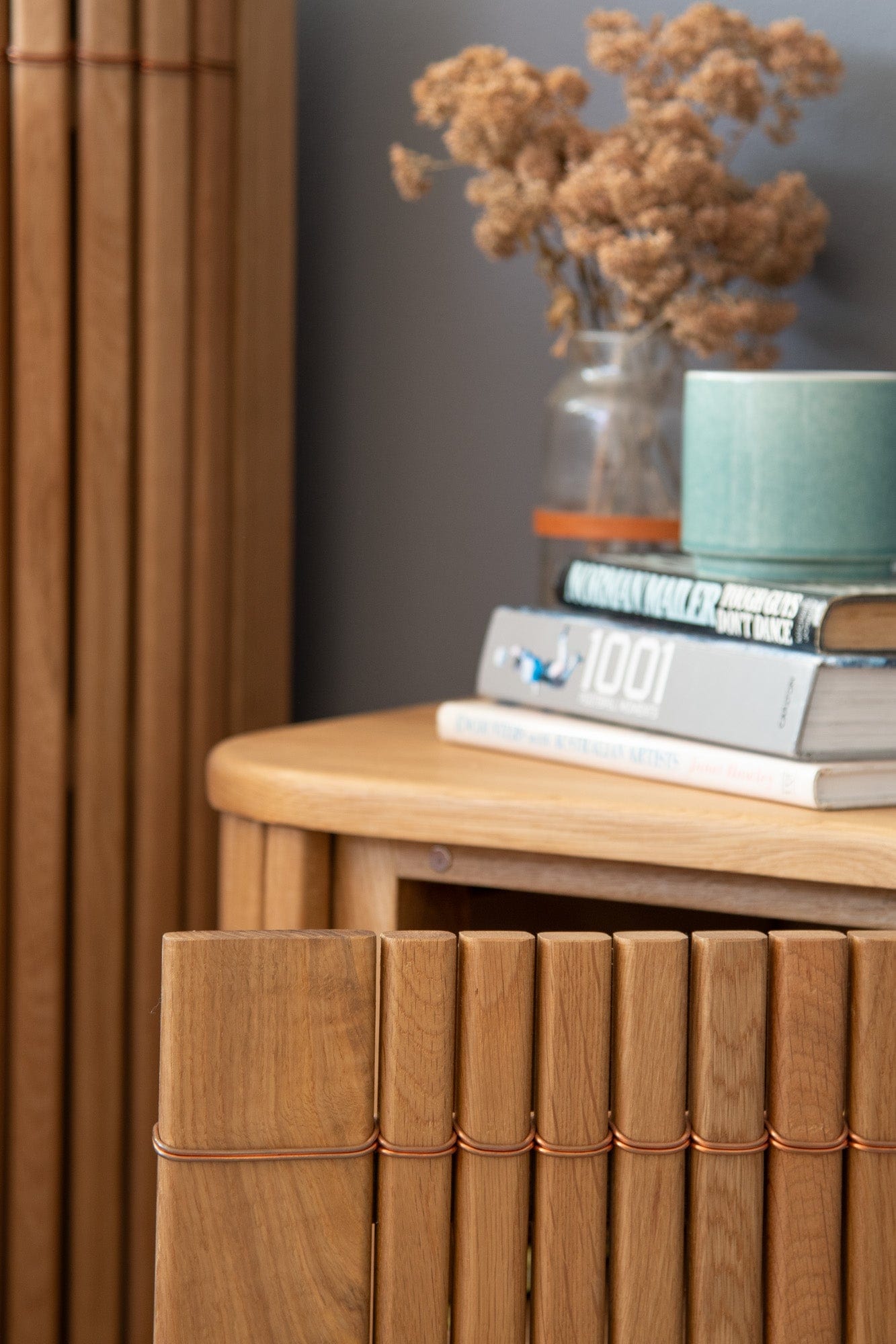 Wooden cabinet with decor and books