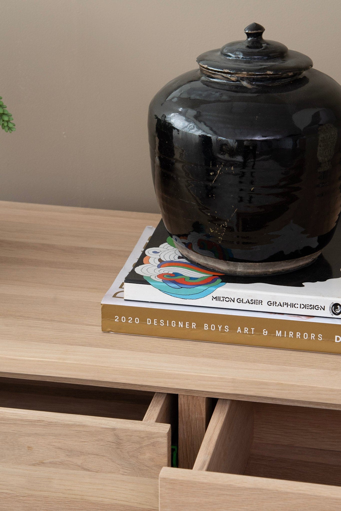 Black ceramic jar on books, DSC_2754