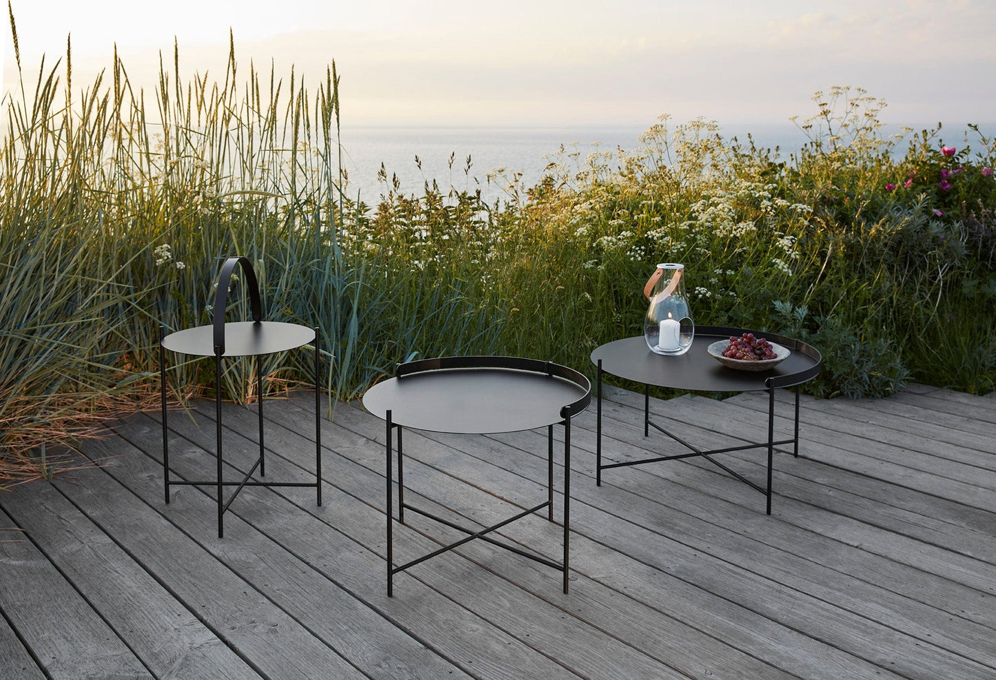 Black EDGE side tables in 3 sizes on a deck