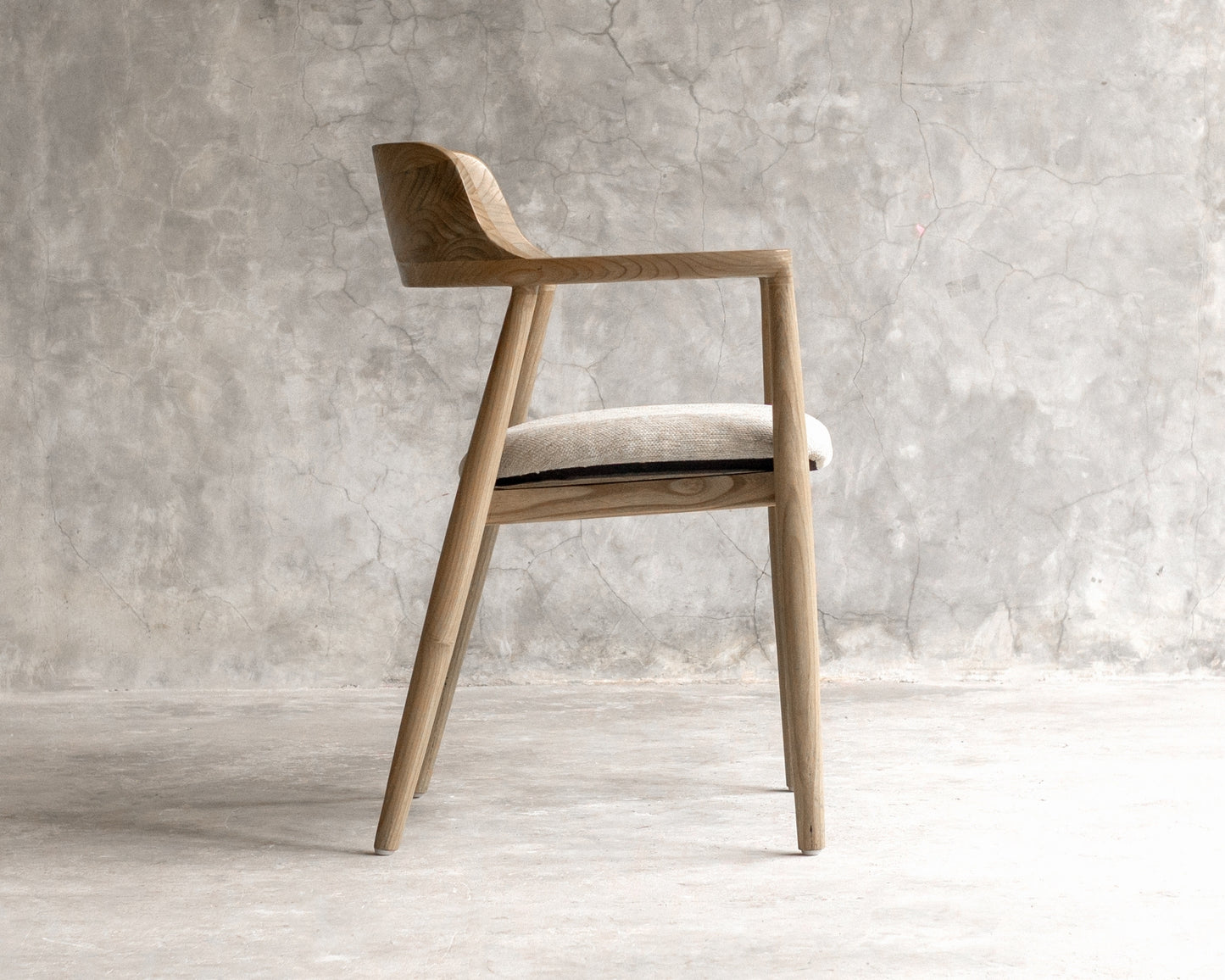 Wooden armchair with neutral cushion
