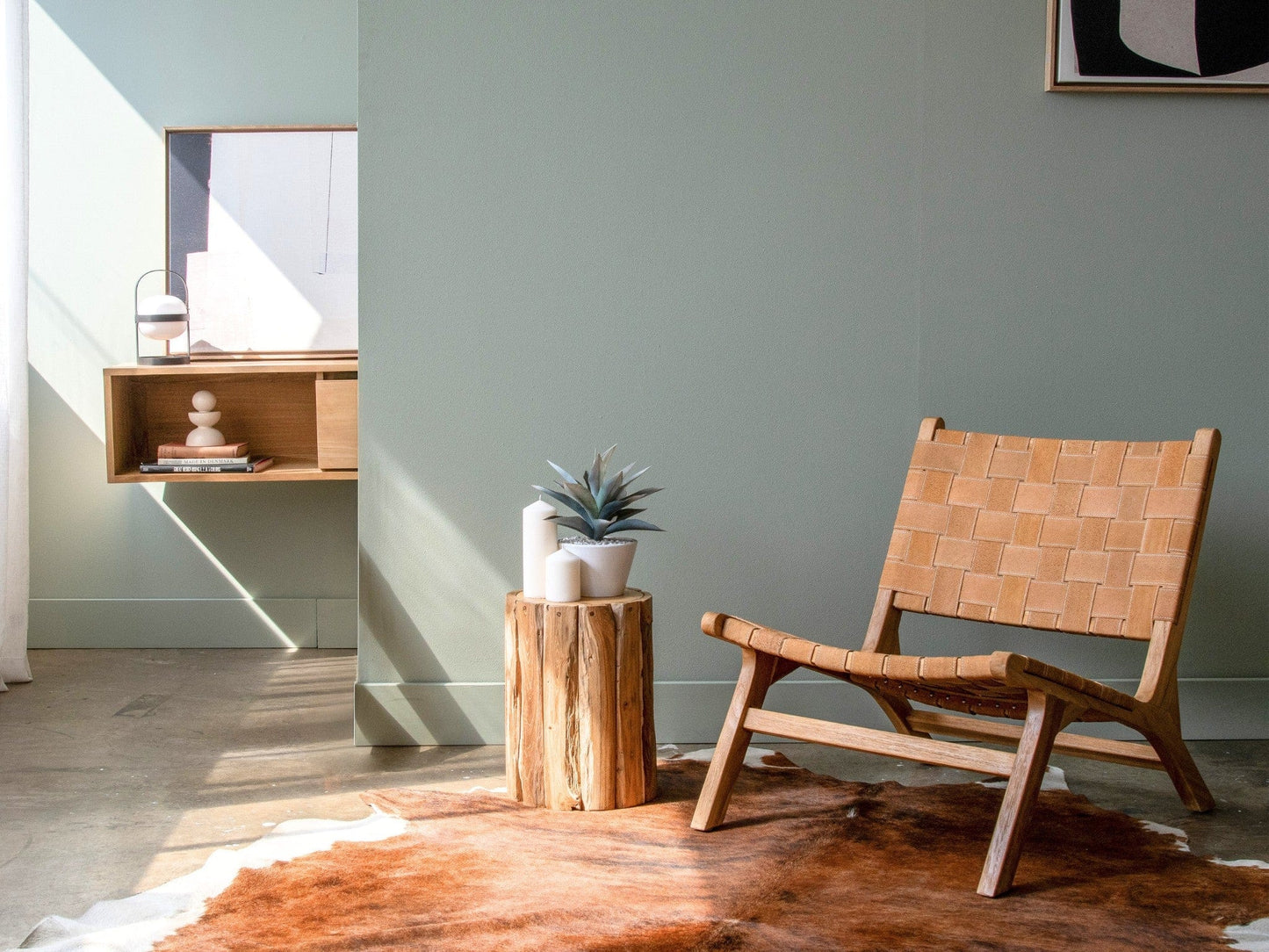 Modern living room with woven chair and plant