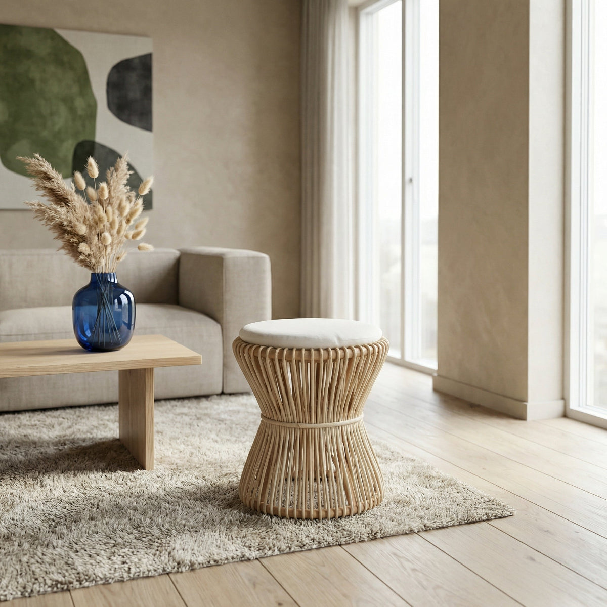 Modern living room with a wicker stool, wooden coffee table, and decorative vase.