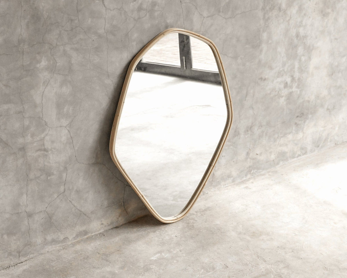 ELE124 Mirror - Modern geometric wall mirror against a concrete wall.