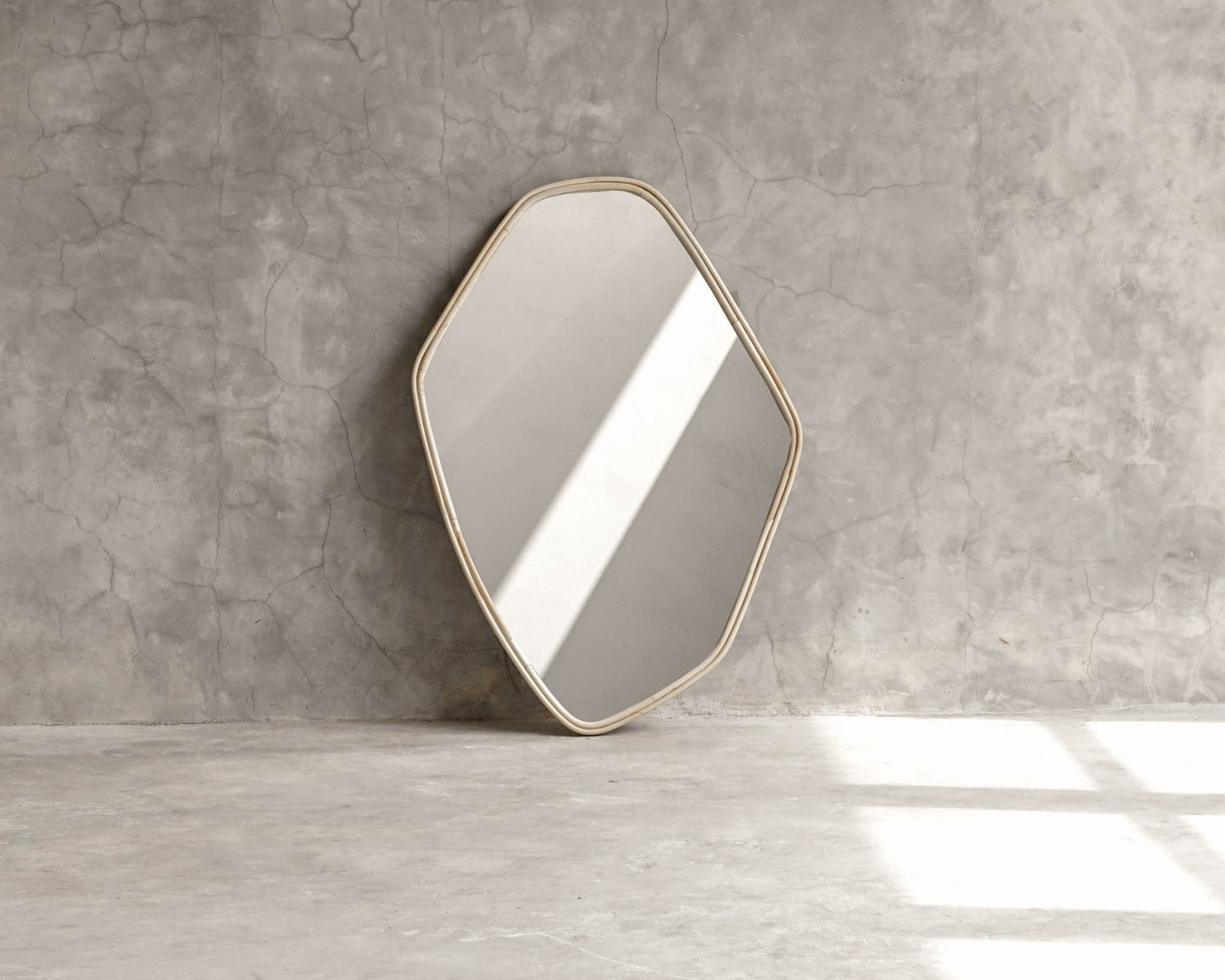 Geometric wall mirror (ELE126) against concrete wall
