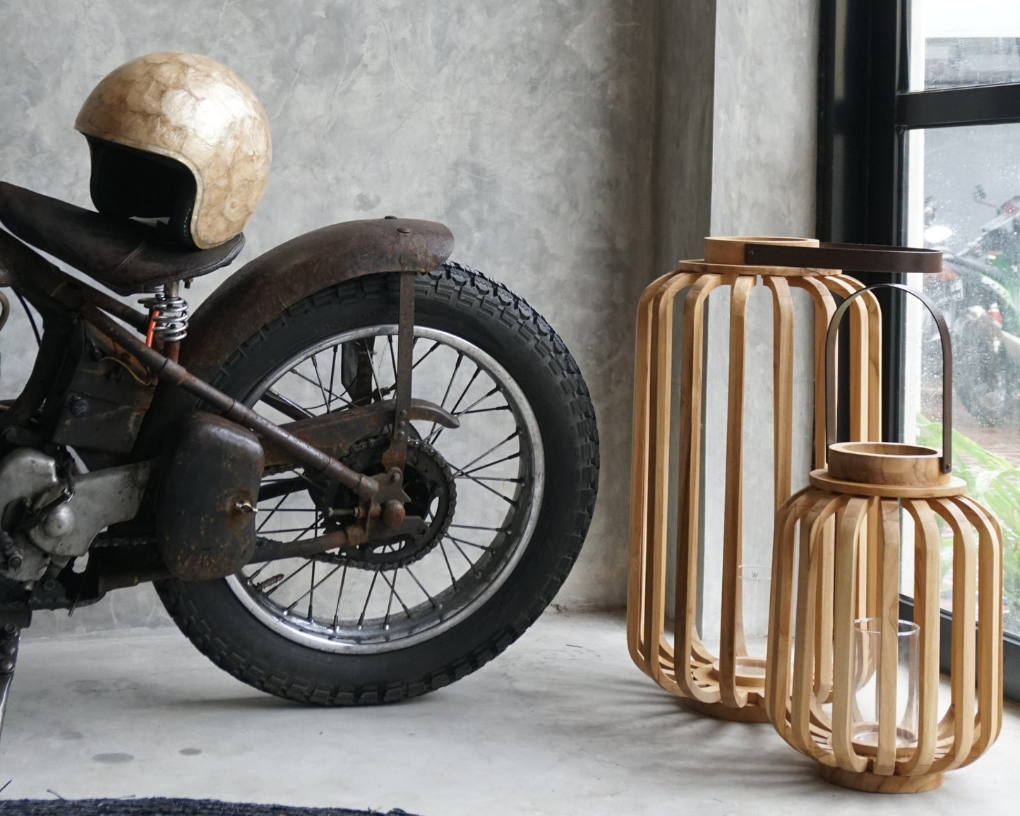 Vintage motorcycle and wooden lanterns