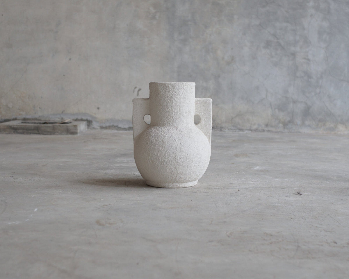White textured vase with handles.