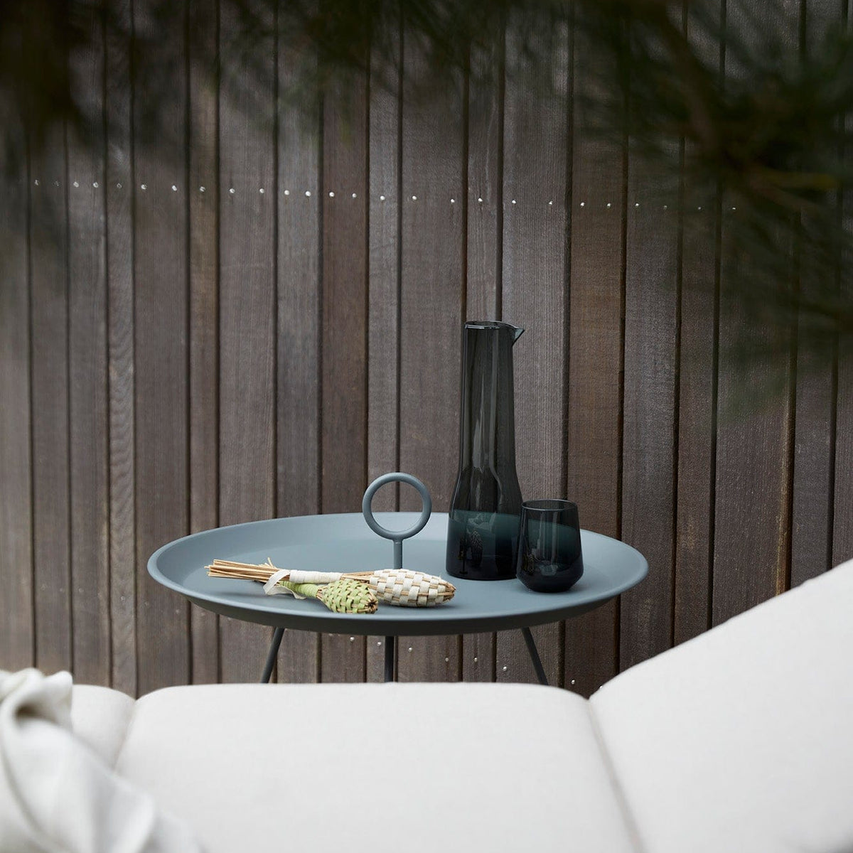 Dark grey HOUE MOLO cushion with EYELET table and decor.