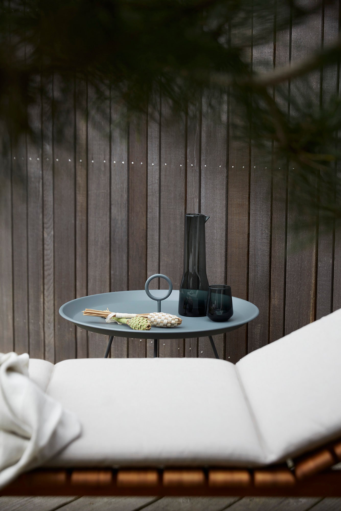 Dark grey HOUE MOLO cushion with EYELET table and decor.
