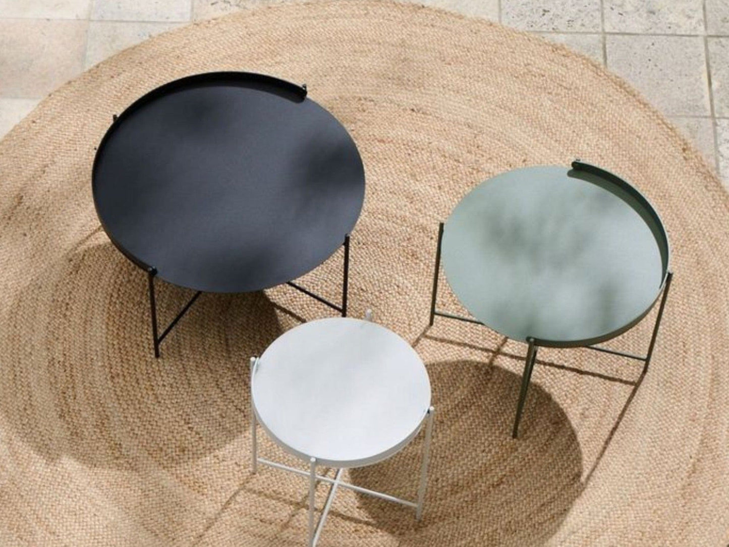 Edge table set in various colors on a rug
